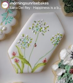 decorated cookies with flowers and leaves on them