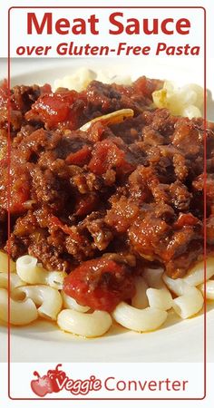 meat sauce over gluten - free pasta on a white plate with red border