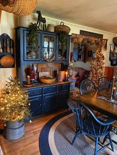 a dining room filled with furniture and christmas decorations