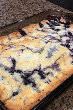 a pan filled with blueberry cobble sitting on top of a counter