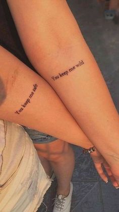 two people with tattoos on their legs that say, i love you so much and they are