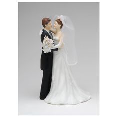 a wedding cake topper with a bride and groom