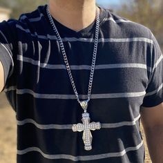 Men's huge iced cross pendant hip hop chain. 30" x 8mm cuban chain with a lobster lock. Heavy alloy metal core w/ silver tone finish. Huge pendant is 5" tall w/bale and 2.75 wide. Pendant iced with dazzling round-cut stones. Sturdy well made pendant has a caged back. Solid neck piece has good weight at 180 grams. Luxury Iced Out Silver Cuban Link Necklace, Iced Cross Necklace, Iced Out Cross Necklace, Cuban Link Silver Chain Necklace For Streetwear, Iced Out Cross Chain, Silver Iced Out Cross Pendant Necklace, Hip Hop Chains, Cuban Chain Necklace, Metal Core