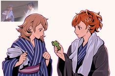 two people dressed in robes and one is holding a frog