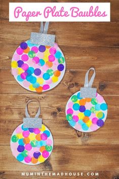 three paper plate baubles with glitter on them