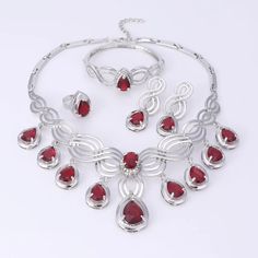 Elegant Crystal Statement Necklace Set Red Alloy Jewelry For Party, Red Alloy Jewelry As A Gift, Elegant Red Metal Jewelry, Elegant Christmas Formal Jewelry, Elegant Christmas Jewelry For Formal Occasions, Christmas Party Jewelry With Cubic Zirconia, Ruby Jewelry Sets For Party, Elegant Metal Jewelry Sets For Valentine's Day, Crystal Jewelry For Christmas Party