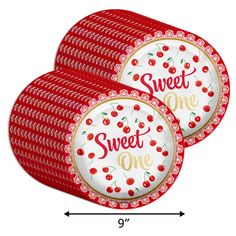 red and white plates with the words sweet one printed on them