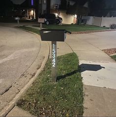 a mailbox sitting on the side of a street