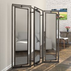 a room divider with three mirrors in it