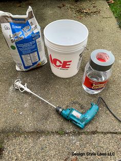 the tools needed to make an ice cream treat are sitting on the ground next to some buckets