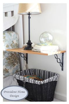 a basket under a table next to a lamp