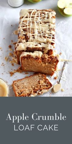 an apple crumble loaf cake with white icing on top and sliced into slices