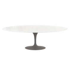 an oval dining table with a white marble top and grey metal base, viewed from the front