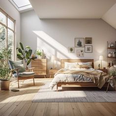 a bedroom with white walls and wooden floors, large windows, potted plants on the wall