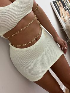 Gorgeous Cream crinkle low rise curve waist micro mini skirt, with gold belly chain. Ultra body hugging bandage style fit. Hand made by us in super stretchy crinkle seersucker textured quality Lycra mix. Size S-M fits 6-8-10-12 Chic Gold Mini Length Bottoms, Gold Mini Skirt For Summer, Fitted Gold Mini Skirt For Summer, Gold Stretch Mini Skirt For Party, Gold Stretch Skirt For Summer, Bow Bandeau, Mini Rock, Micro Mini Skirt, Belly Chain