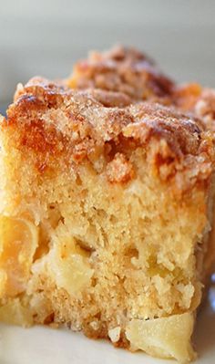 a close up of a piece of cake on a plate with a fork in it