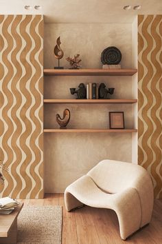 a living room filled with furniture next to a wall mounted book shelf on top of a hard wood floor