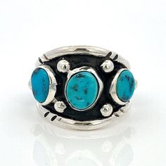 Handmade Turquoises Three Stone Ring Set In Sterling Silver  Navajo, Southwestern Style - Size 9.5 -ET1304 Ring Size: 9.5- can be resized Metal Content: .925 Sterling Silver- tested Face Height (North to South): 3/4" (19mm) Height of ring off of finger: 6mm Ring Shank Width: 5mm Gemstones; Three freeform Turquoise Gemstones Weight: 9.61 Grams Stamps: none noted Condition: Very Good Pre-Owned Vintage ring Each piece is thoroughly examined and refinished as needed by our professional jewelers, tested to guarantee metal content,  graded by our in-house GIA (Gemological Institute of America) Graduate Gemologist, and inspected for quality before being carefully packaged and promptly shipped. Thank you for taking the time to shop with us! We have hundreds of more listings, with more being added Southwestern Turquoise Ring With Concho, Adjustable Southwestern Turquoise Concho Ring, Three Stone Ring Settings, Southwestern Multi-stone Turquoise Ring, Sterling Silver Multi-stone Turquoise Ring, Blue Multi-stone Turquoise Ring In Sterling Silver, Silver Southwestern Multi-stone Turquoise Necklace, Adjustable Southwestern Turquoise Ring Nickel-free, Southwestern Style