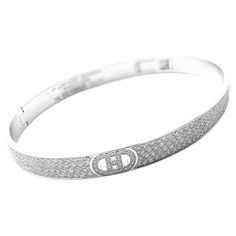 18k White Gold Diamond H D'Ancre Small Model Bangle Bracelet by Hermes. With 443 Round brilliant cut diamonds VVS1 clarity E color total weight approx. 3.09ct Details: Length: Size: SH Length: 6.2" Width: 6mm Weight: 18.7 grams Stamped Hallmarks: Hermes 750 Made In France 15A05XXXXX(serial number omitted) 443D3,09CT French Hallmarks *Free Shipping within the United States* YOUR PRICE: $33,900 T2950mnedd White Gold Bangle, Gold Bangle Bracelet, Diamond Bangle, Round Brilliant Cut Diamond, Gold Bangles, Brilliant Cut Diamond, White Gold Diamonds, Bangle Bracelet, Diamond White