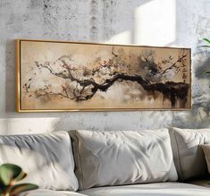 a painting hanging on the wall above a couch