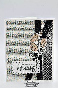 a card with an image of flowers and the words you're absolutely amazing on it