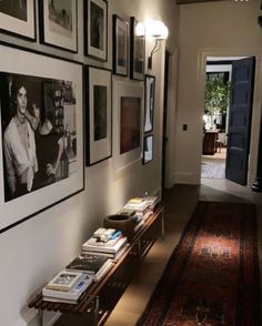 the hallway is decorated with black and white photos