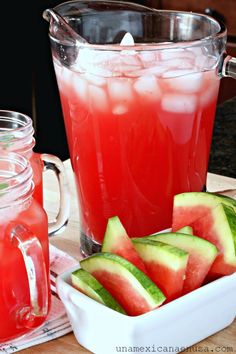 watermelon and cucumber drink in pitchers on a table