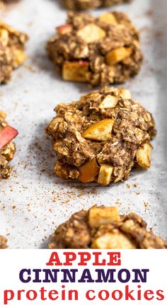 apple cinnamon protein cookies on a baking sheet with text overlay that reads, apple cinnamon protein cookies