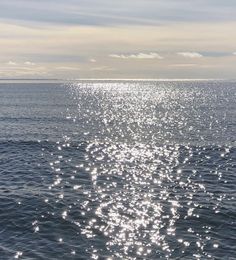 the sun shines brightly on the water as it reflects off the ocean's surface