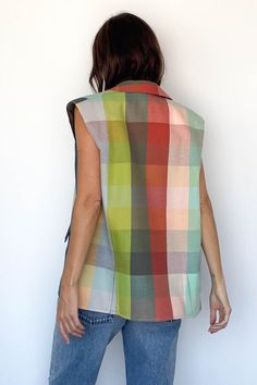 Parachute Vest from Marrakshi Life Sleeveless, open cotton vest in a rainbow plaid pattern Shawl collar, padded shoulders Two front pockets Relaxed, oversized fit 100% Cotton Hand woven in Marrakesh Model Measurements & Item Sizing: Model Height: 5'8” Model Size: US 2 / S / 26 Size shown on model: O/S Multicolor Sleeveless Vest For Fall, Casual Plaid Vest For Spring, Sleeveless Multicolor Cotton Outerwear, Multicolor Sleeveless Cotton Outerwear, Marrakshi Life, Swim Jewelry, Rainbow Plaid, Brother Vellies, Cotton Vest