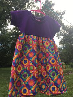 a colorful dress hanging on a clothes line