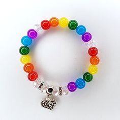 Taste The Rainbow Love Bracelet Handmade By Me Crystal Beaded Stretch Bracelet 7.5" Length Tibetan Silver Heart Charm Rhinestone Accents Simulated Crystal & Gemstone Beads New Ring Not Included Adjustable Rainbow Heart Beads Jewelry, Multicolor Heart Bracelet With Colorful Round Beads, Multicolor Heart Beads Bracelet, Adjustable Rainbow Beaded Bracelets With Heart Beads, Multicolor Heart Charm Bracelets With Round Beads, Multicolor Bracelets With Heart Charm And Round Beads, Multicolor Stretch Bracelet With Heart Beads, Multicolor Round Beads Bracelet With Heart Charm, Multicolor Heart Beads Stretch Bracelet