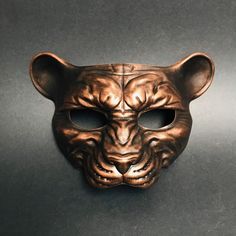 This copper panther mask captures the essence of a mighty panther, infusing your look with fierceness and undeniable presence. From Halloween parties to themed events and masquerade parties, our panther mask is the purr-fect addition to any look!


Age Group/Gender - Adult/Unisex

Size/Type - One size fits all adults

Mask Color - Copper

Mask Material - Polyresin Masquerade Mask With Whiskers, Halloween Masquerade Masks With Whiskers, Diy Masquerade, Diy Masquerade Mask, Mardi Gras Masks, Masquerade Ball Mask, Lion Mask, Animal Mask, Mask Halloween