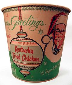 an old fashioned ice cream cup with a christmas ornament on the front and side