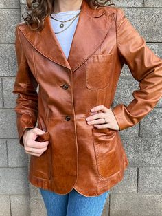 "The Bonwit Teller store was one of the highest quality 5th Ave. stores of the late 1800s-1900s, carrying the most well made couture labels in women's apparel. This warm caramel colored leather blazer is a rare & beautiful example of this. Made in Israel by Beged-Or, it is expertly tailored for a perfect fit. Some of the highest quality leather work I have ever come across, it is in gorgeous condition and is ready for a lifetime of wear. Lined in soft satin, extra button sewn in to inside of jac Kelvin Klein Women, Kelvin Klein, Cute Summer Shirts, Long Slip Dress, Brown Fits, Button Up Jacket, Leather Jacket Outfits, Caramel Brown, Denim Midi Skirt