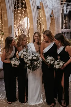 the bridesmaids are all dressed in black and white