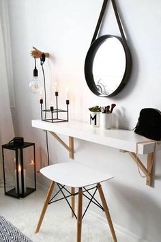 a white desk and mirror in a room