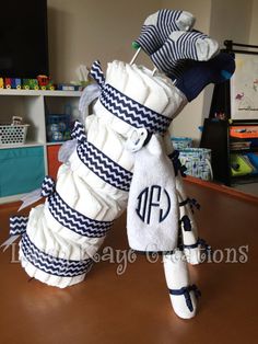 two golf clubs made out of towels on top of a table