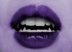 an open mouth with white teeth and purple lipstick