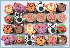 the cupcakes are decorated with animals and letters that spell out love on them