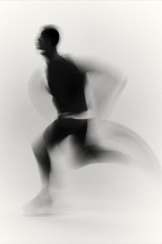 a blurry photo of a man running