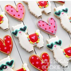 decorated cookies with hearts and llamas on them