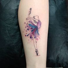 a watercolor ballerina tattoo on the leg