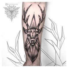 a black and white photo of a deer with geometric shapes on it's leg