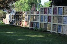 a fence made out of old window panes