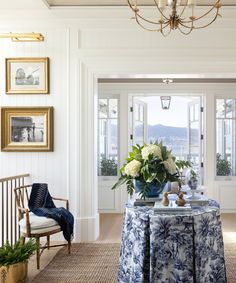 a dining room with blue and white table cloths