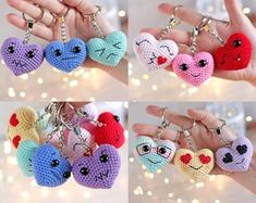 four different keychains with faces on them in the shape of heart shaped hearts