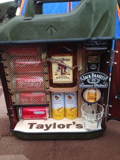 a cooler filled with liquor bottles and other items