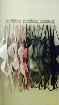 there are many bras hanging on the wall