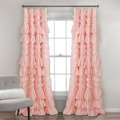 the curtains in this room have ruffled edges and are light pink with white trim